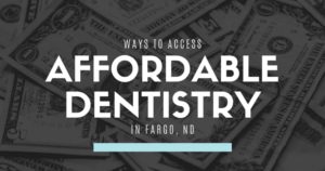 A background of dollar bills with the text "Ways to access affordable dentistry in Fargo, ND"